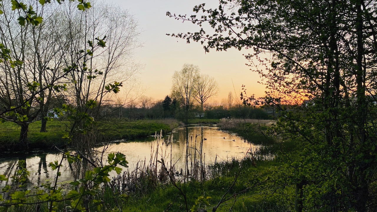 Drongen water stream with monastery in the background