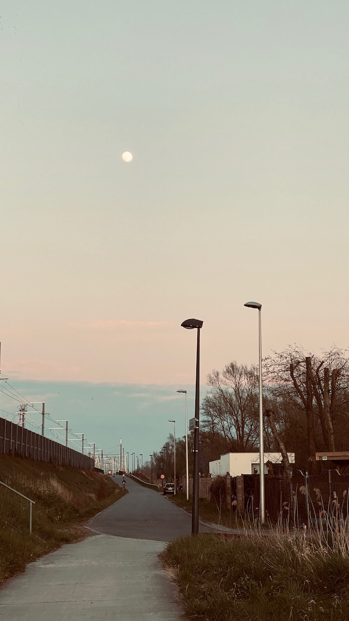 Street next to railway in dawn lights